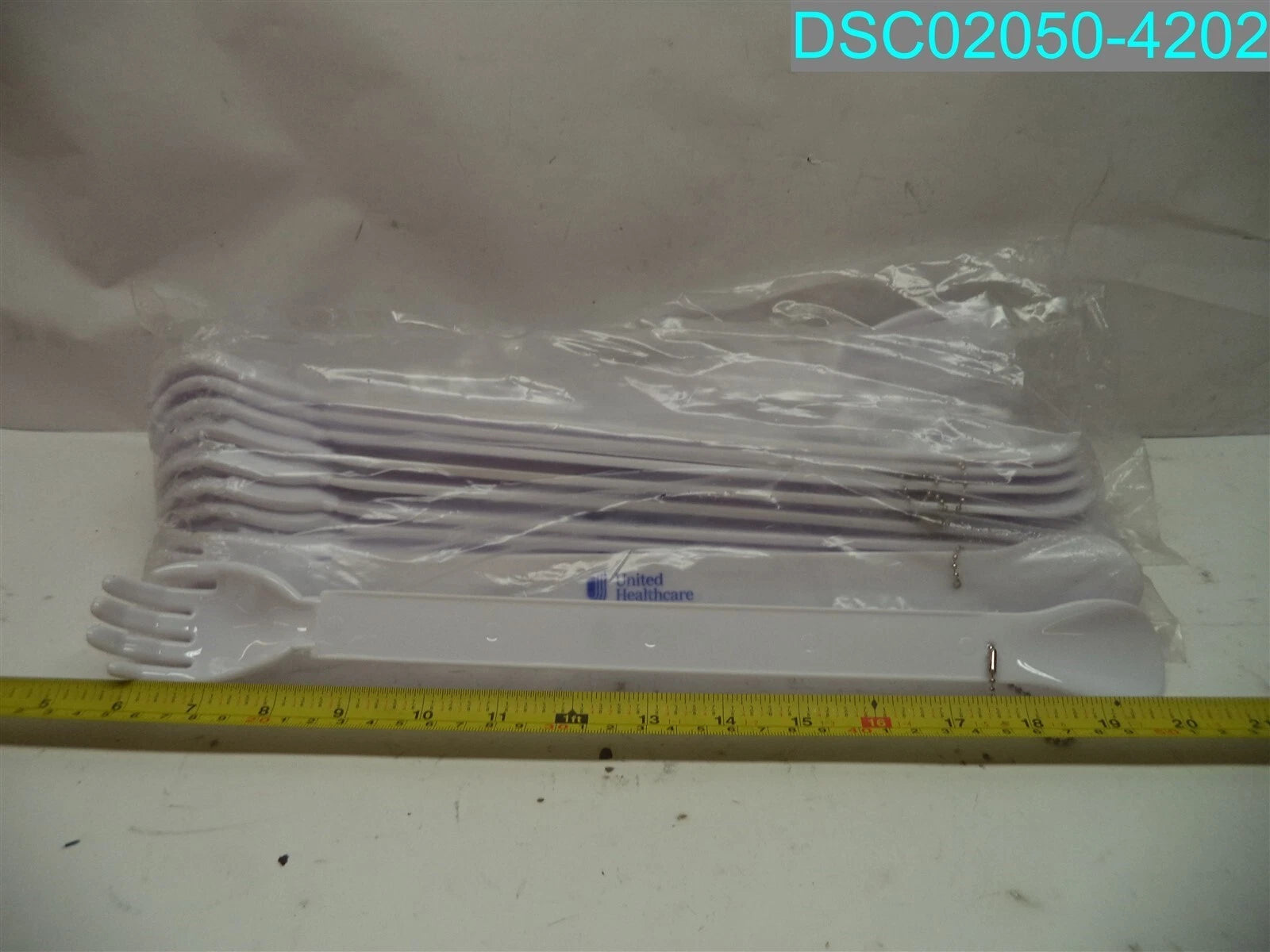 QTY=19: White United Healthcare Shoe Horn & Back Scratcher