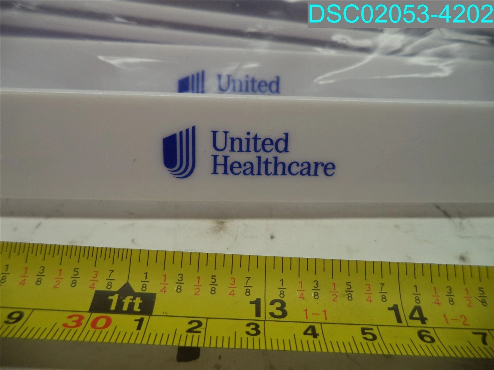 QTY=19: White United Healthcare Shoe Horn & Back Scratcher